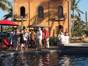 guests gathered around the pool for cocktails and appetizers