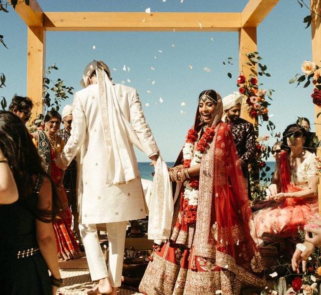 Bride and groom celebrating an Indian destination wedding in Todos Santos, Baja